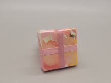 Load image into Gallery viewer, 3 Tier Presents Wrapped in Pink and Yellow Paper with Pink Bow
