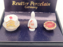 Load image into Gallery viewer, Dollhouse Miniature ~ Bell, Cake, and Bowl with Santa Image - Reutter Porcelain
