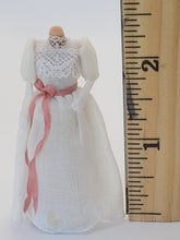 Load image into Gallery viewer, Handmade White Lacey Dress with Pink Ribbon on Mannequin
