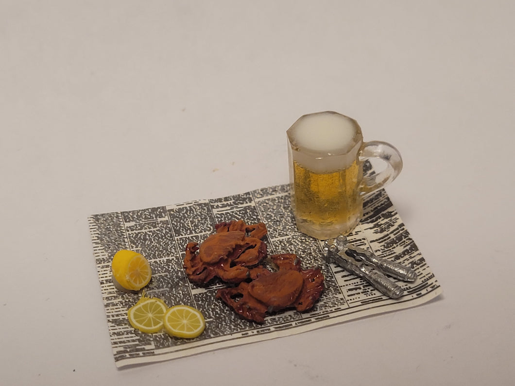 Crabs and Beer with Lemon on Newspaper
