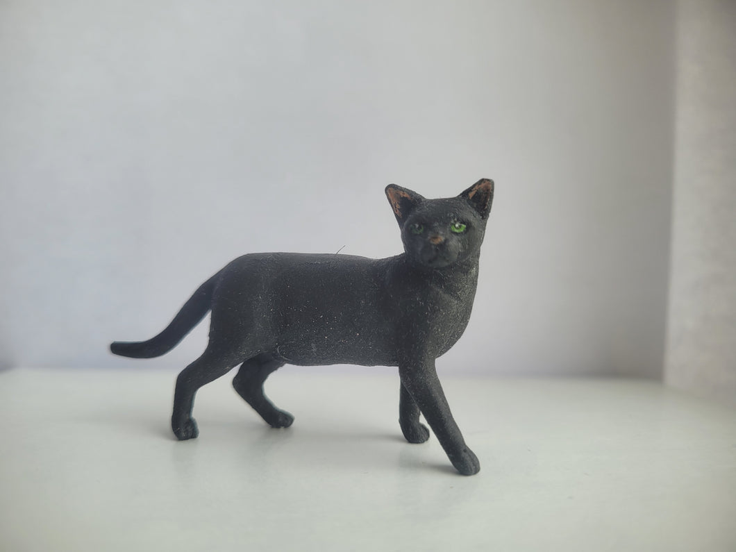 Black cat with Green Eyes Standing - by Karl Blindheim