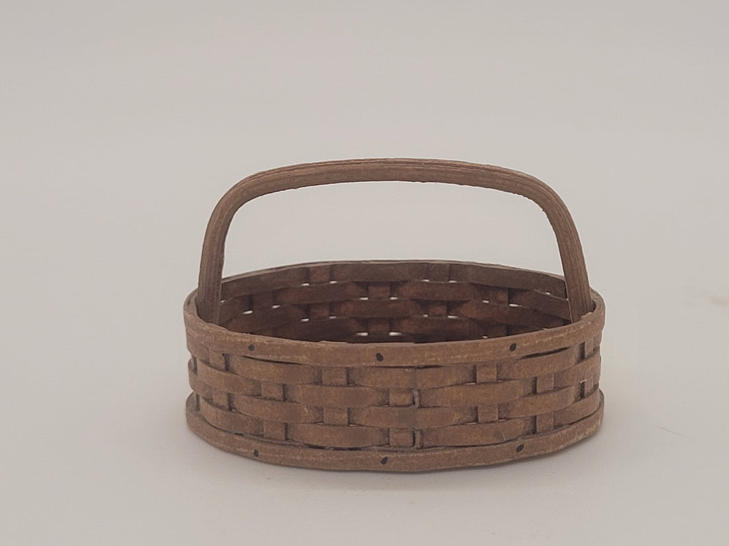 Al Chandronnait – Oval Woven Brown Basket with Handle Bar