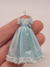 Load image into Gallery viewer, Dollhouse Miniature ~ 1:24 Scale, Blue Dress with White Lace Details on Wire Hanger
