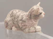 Load image into Gallery viewer, Resin Grey Striped Cat Laying with Paw Hanging
