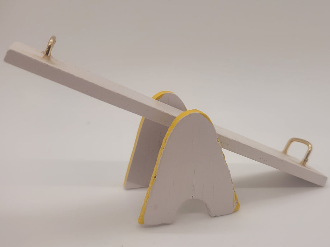 Yellow and White Wooden Teeter-Totter