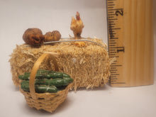 Load image into Gallery viewer, Haybale with Chicken and Cucumbers in Woven Basket

