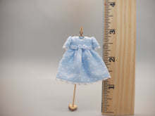 Load image into Gallery viewer, Blue and White Polka Dot Dress with Bow on Wooden Stand – by Cheryl Warder
