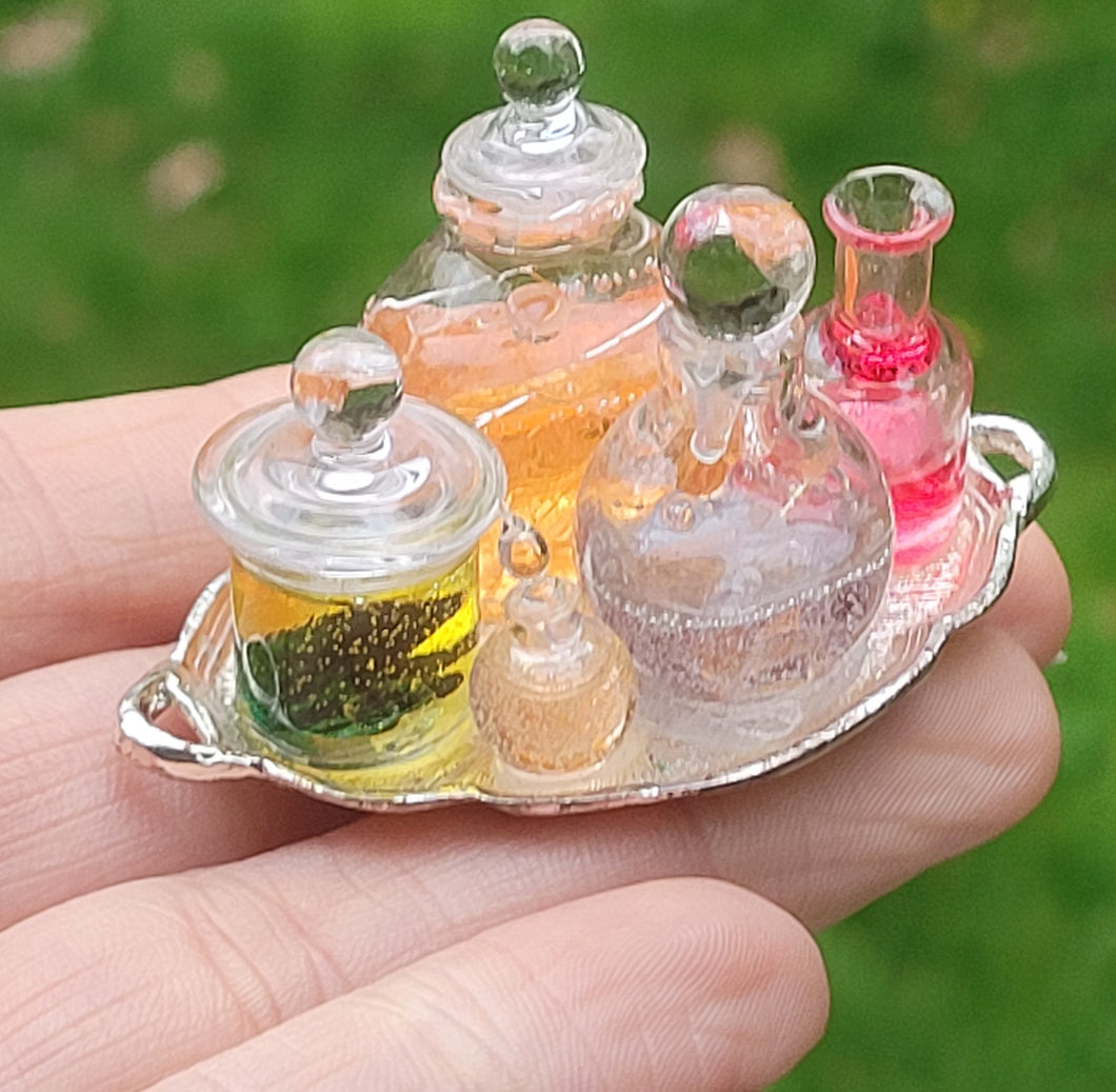 Potions and Frog in Glass Jar on Metal Platter