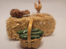 Load image into Gallery viewer, Haybale with Chicken and Cucumbers in Woven Basket
