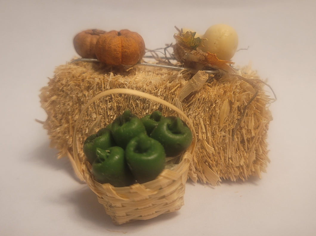 Haybale with Basket of Peppers