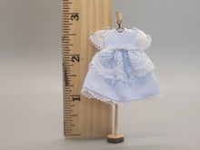 Load image into Gallery viewer, Blue Dress with White Lace Detailing on Wooden Stand - by Cheryl Warder
